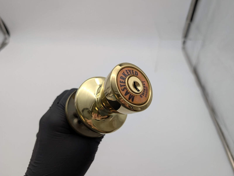 Kwikset Entry Door Knob Double Cylinder 2-3/8" Backset Bel Air Polished Brass