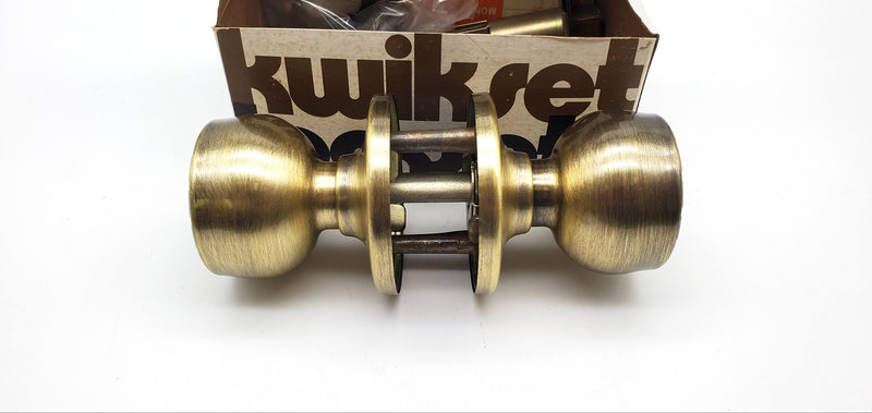 Kwikset Grecian Door Knob Passage Latch 2-3/8" Backset Antique Brass 200G
