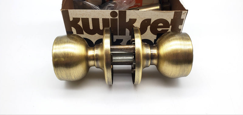 Kwikset Grecian Door Knob Passage Latch 2-3/8" Backset Antique Brass 200G