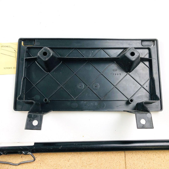 Jeep 4334776 License Plate Bracket 4334775 OEM NOS Black Plastic 8