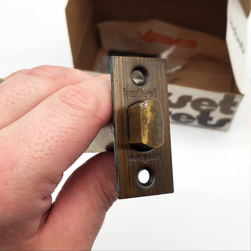 Kwikset Grecian Door Knob Passage Latch 2-3/8" Backset Antique Brass 200G