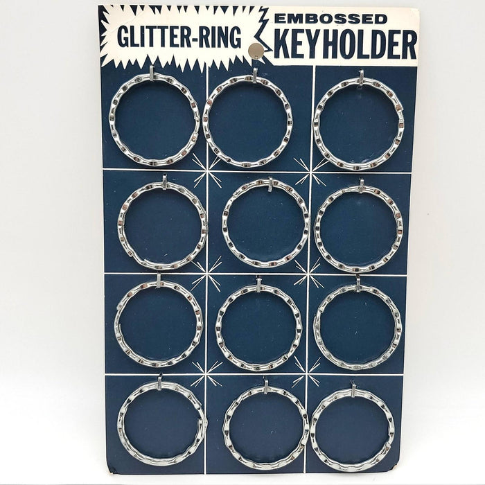 12x Glitter Ring Key Holders 1-3/8" Embossed Steel Carded No 1645 Vintage NOS