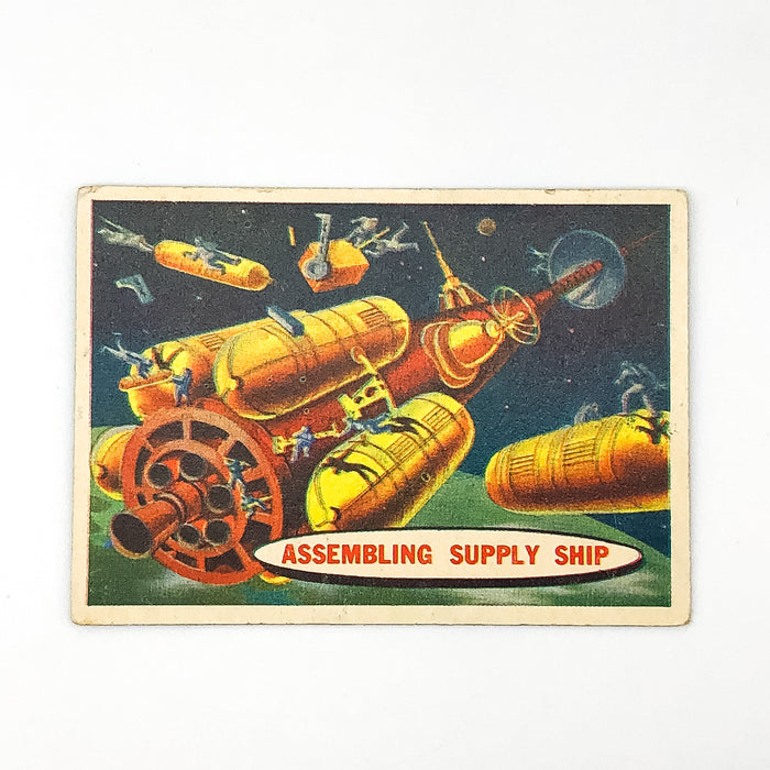 1957 Topps Space Card #54 Assembling Supply Ship Chewing Gum Moon Cartoon Art