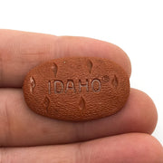 Idaho Potatoes Lapel Pin Potato Shaped Brown Plastic Insignia 1