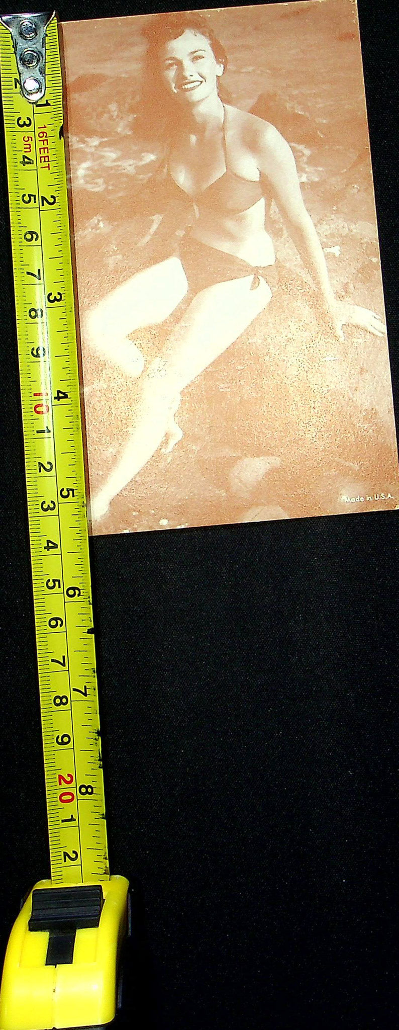 US 50s Pin Up Promo Photo Card Woman Bikini Swimsuit Sitting Rocks Beach Shore
