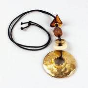 Gold Toned Statement Necklace Metal Donut Amulet Corded 1