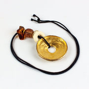 Gold Toned Statement Necklace Metal Donut Amulet Corded 2