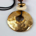 Gold Toned Statement Necklace Metal Donut Amulet Corded 5